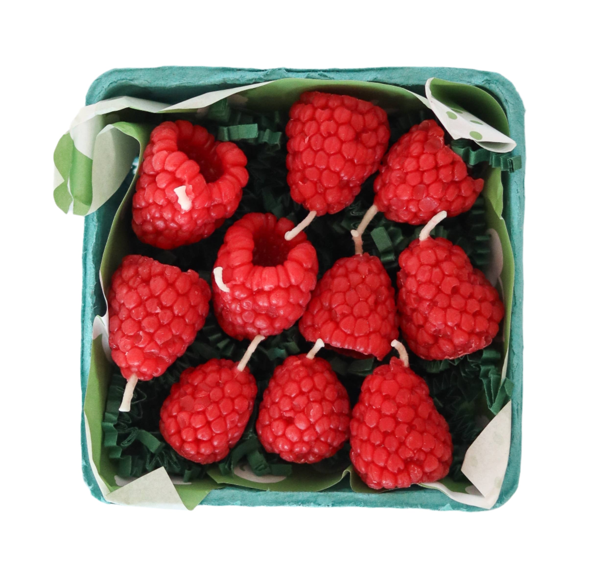 Beeswax raspberry birthday candles in berry basket packaging with green crinkle paper